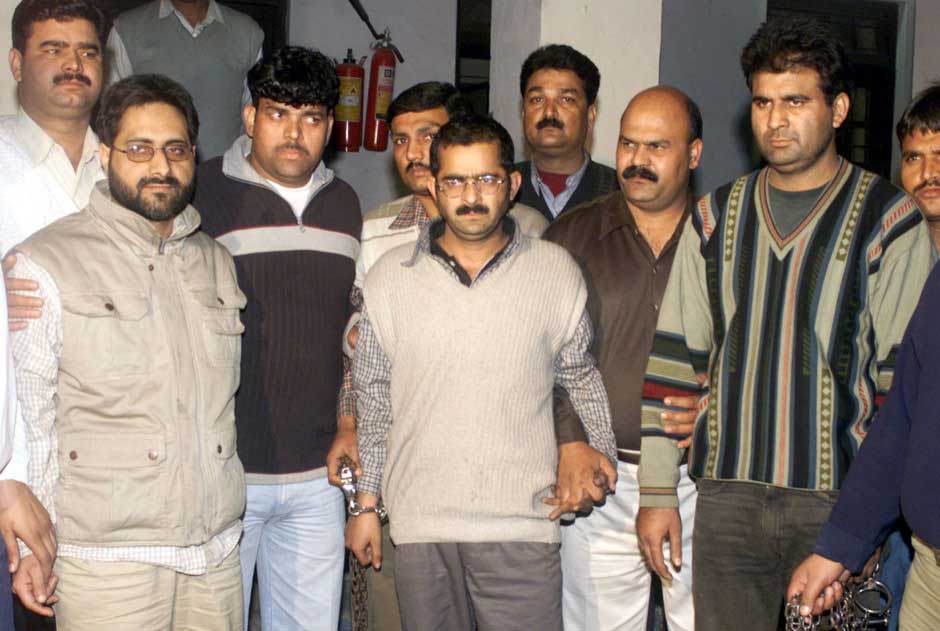Indian police present Syed Abdul Rehman Geelani (front L), Mohammed Afzal Guru (front C) and Shaukat (front right) at a press conference on 16 December, 2001. The police said that the three were arrested in connection with the attack on Parliament. Reuters Indian police present Syed Abdul Rehman Geelani (front L), Mohammed Afzal Guru (front C) and Shaukat (front right) at a press conference on 16 December, 2001. The police said that the three were arrested in connection with the attack on Parliament. Reuters