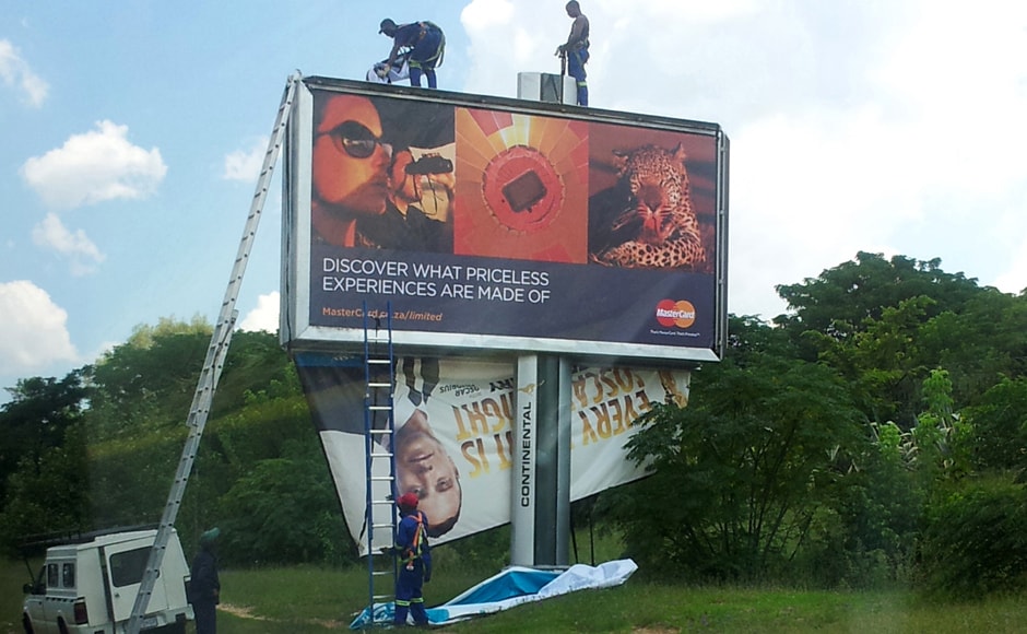 Workers taking down a billboard of Pistorius endorsing a product in Johannesburg. AP Workers taking down a billboard of Pistorius endorsing a product in Johannesburg. AP