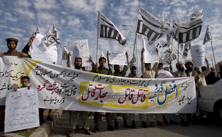 Jamat-ud-Dawa supporters chant anti-Indian slogans behind a banner reading as 'salute to Kashmiri hero Afzal Guru Martyr' and 'declare India as terrorist country as it is killers of millions of Kashmiris,' during a demonstration to condemn the hanging Afzal Guru in Islamabad. AP Jamat-ud-Dawa supporters chant anti-Indian slogans behind a banner reading as 'salute to Kashmiri hero Afzal Guru Martyr' and 'declare India as terrorist country as it is killers of millions of Kashmiris,' during a demonstration to condemn the hanging Afzal Guru in Islamabad. AP