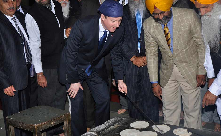 UK PM David Cameron prepares bread at a community kitchen during his visit to the holy Sikh shrine of Golden temple. Reuters UK PM David Cameron prepares bread at a community kitchen during his visit to the holy Sikh shrine of Golden temple. Reuters