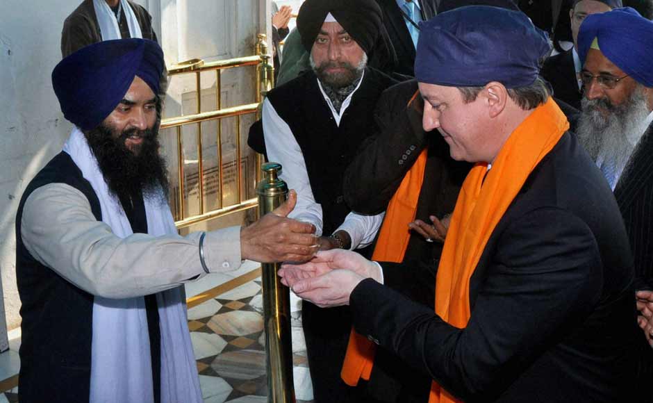 UK PM David Cameron at the Golden Temple in Amritsar today. PTI UK PM David Cameron at the Golden Temple in Amritsar today. PTI