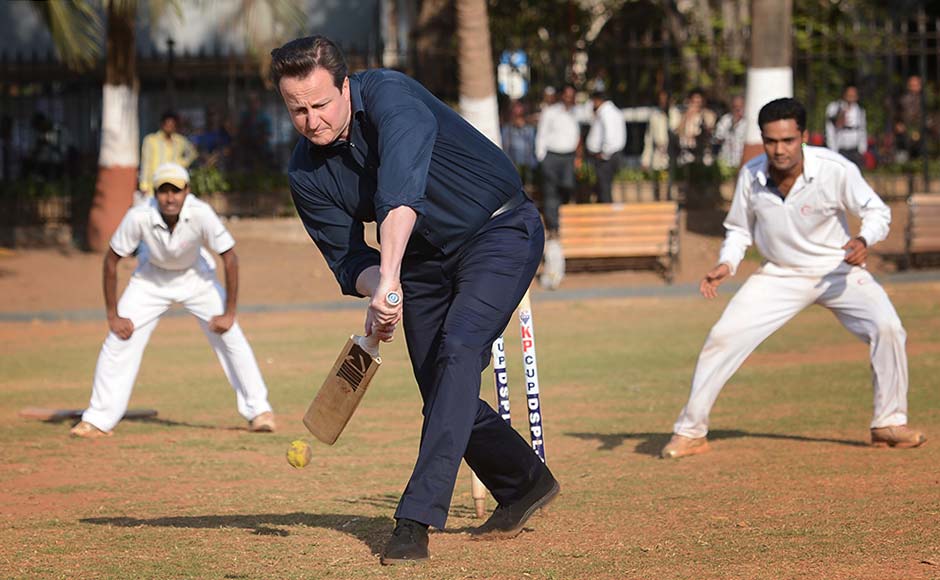 Britain's Prime Minister David Cameron plays cricket with boys at the Oval Maidan, Mumbai. AP Britain's Prime Minister David Cameron plays cricket with boys at the Oval Maidan, Mumbai. AP