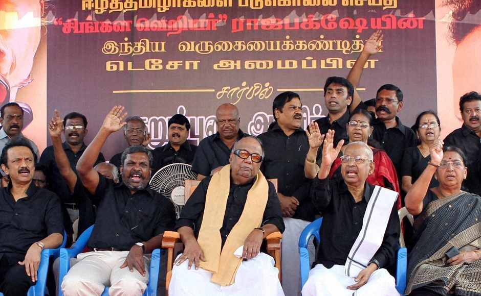 DMK chief M Karunanidhi along with members of Tamil Eelam supporters organization(TESO), put on black outfits to protest against Sri Lankan President Mahinda Rajapaksa's visit to India, at Valluvar Kottam in Chennai. PTI DMK chief M Karunanidhi along with members of Tamil Eelam supporters organization(TESO), put on black outfits to protest against Sri Lankan President Mahinda Rajapaksa's visit to India, at Valluvar Kottam in Chennai. PTI