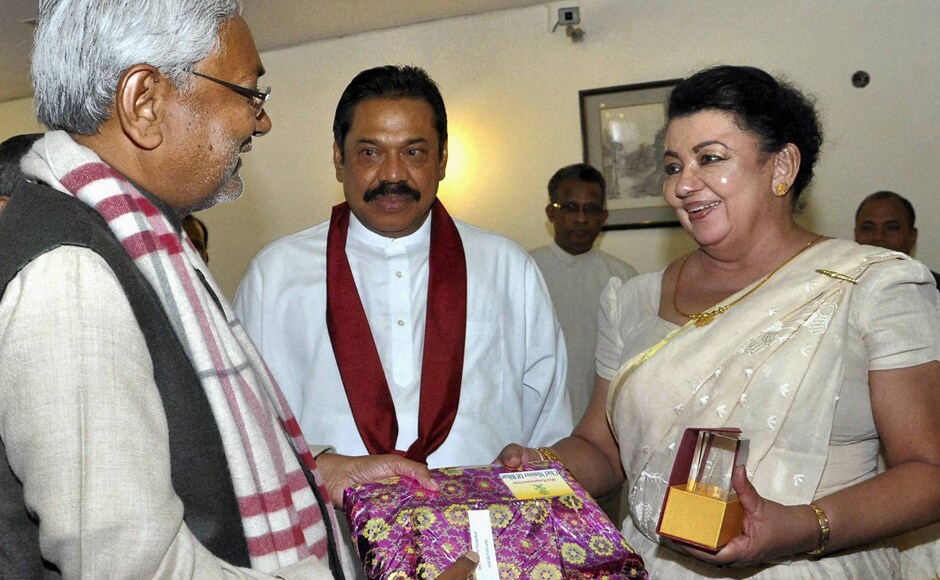 Bihar Chief Minister Nitish Kumar presents a memo to Mahinda Rajapaksa. PTI Bihar Chief Minister Nitish Kumar presents a memo to Mahinda Rajapaksa. PTI