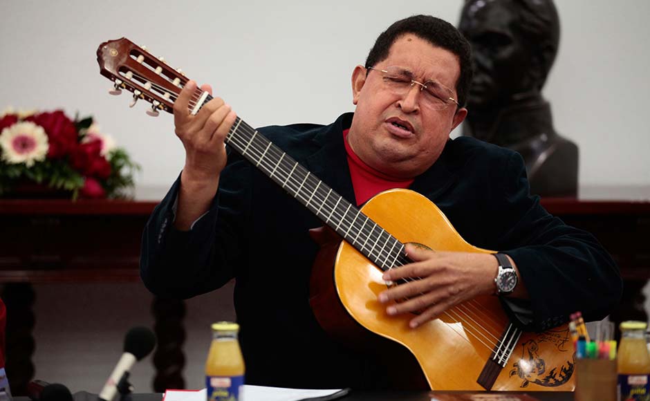 Venezuelan President Hugo Chavez plays a guitar, which was a gift from Mexican singer Vicente Fernandez, during a cabinet meeting at Miraflores Palace in Caracas September 20, 2012. Miraflores Palace/Reuters Venezuelan President Hugo Chavez plays a guitar, which was a gift from Mexican singer Vicente Fernandez, during a cabinet meeting at Miraflores Palace in Caracas September 20, 2012. Miraflores Palace/Reuters