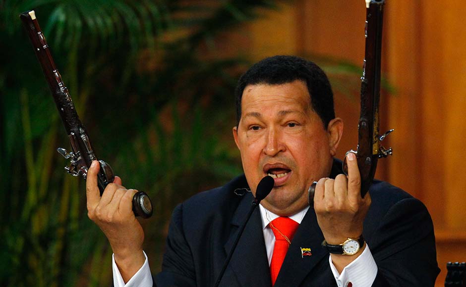 Venezuelan President Hugo Chavez shows the pistols of independence hero Simon Bolivar during a ceremony to mark his birthday in Caracas July 24, 2012. Carlos Garcia Rawlins/Reuters Venezuelan President Hugo Chavez shows the pistols of independence hero Simon Bolivar during a ceremony to mark his birthday in Caracas July 24, 2012. Carlos Garcia Rawlins/Reuters