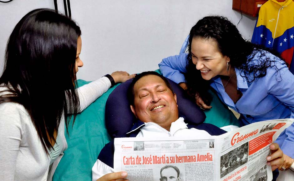 His last public photograph: In this photo released Friday, Feb. 15, 2013 by Miraflores Presidential Press Office, Venezuela's President Hugo Chavez, center, poses for a photo with his daughters, Maria Gabriela, left, and Rosa Virginia as he holds a copy of Cuba's state newspaper Granma at an unknown location in Havana, Cuba Associated Press His last public photograph: In this photo released Friday, Feb. 15, 2013 by Miraflores Presidential Press Office, Venezuela's President Hugo Chavez, center, poses for a photo with his daughters, Maria Gabriela, left, and Rosa Virginia as he holds a copy of Cuba's state newspaper Granma at an unknown location in Havana, Cuba Associated Press