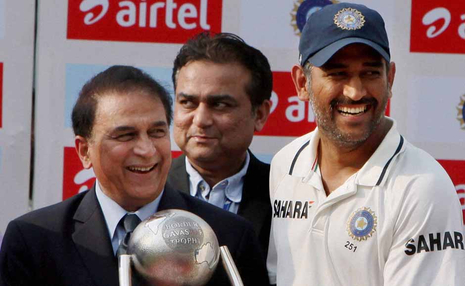 Dhoni collects the Border-Gavaskar trophy from Sunil Gavaskar. PTI Dhoni collects the Border-Gavaskar trophy from Sunil Gavaskar. PTI