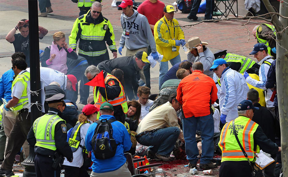 Medical workers aid injured people at the 2013 Boston Marathon following an explosion in Boston, Monday, April 15, 2013. AP Photo/The Boston Globe, David L Ryan Medical workers aid injured people at the 2013 Boston Marathon following an explosion in Boston, Monday, April 15, 2013. AP Photo/The Boston Globe, David L Ryan