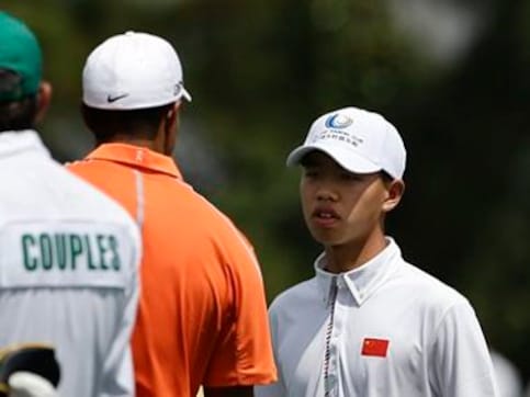 14-year-old Guan impresses Woods without hitting a shot 14-year-old Guan impresses Woods without hitting a shot