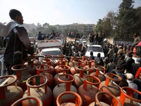 LPG cash subsidy: How oil cos will pay for UPA re-election LPG cash subsidy: How oil cos will pay for UPA re-election