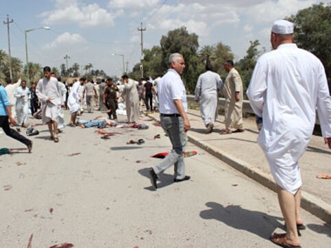 Gunmen shoot dead 14 travelers in Iraq ambush Gunmen shoot dead 14 travelers in Iraq ambush