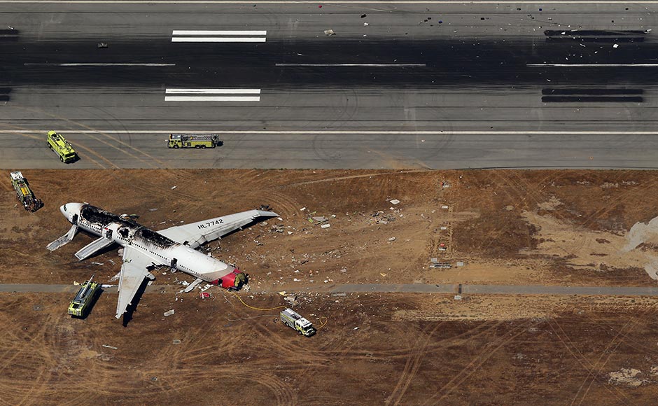 Debris from an Asiana Airlines Boeing 777 plane lies along a runway after it crashed while landing at San Francisco International Airport in California. The plane, with 307 people on board, crashed and burst into flames as it landed at San Francisco International Airport on Saturday after a flight from Seoul. Jed Jacobsohn/Reuters Debris from an Asiana Airlines Boeing 777 plane lies along a runway after it crashed while landing at San Francisco International Airport in California. The plane, with 307 people on board, crashed and burst into flames as it landed at San Francisco International Airport on Saturday after a flight from Seoul. Jed Jacobsohn/Reuters