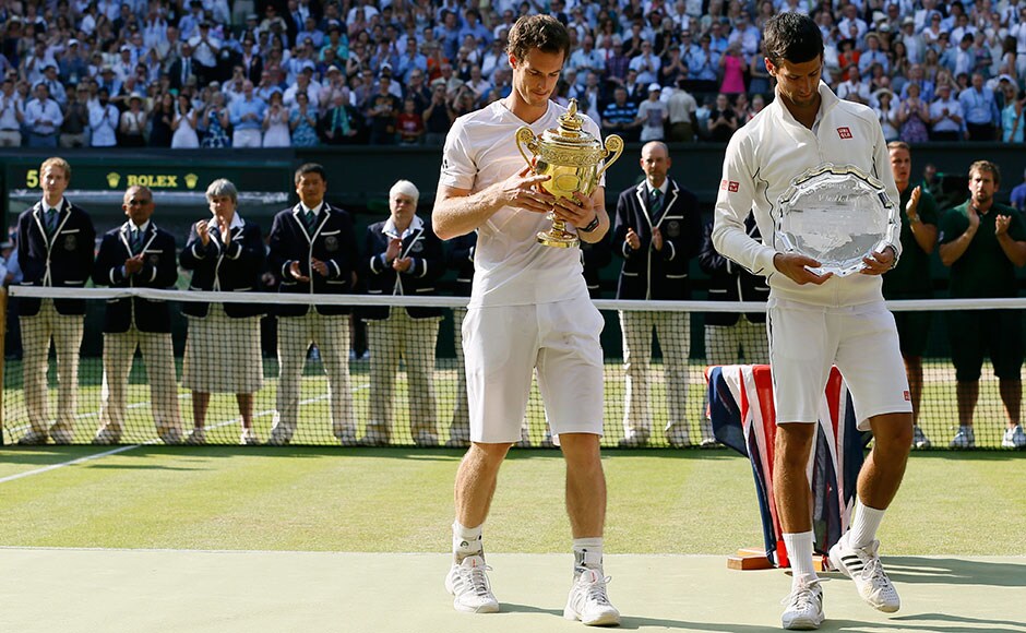 Andy Murray walks with the trophy alongside Novak Djokovic after winning the Men's singles final at Wimbledon. Kirsty Wigglesworth/Associated Press Andy Murray walks with the trophy alongside Novak Djokovic after winning the Men's singles final at Wimbledon. Kirsty Wigglesworth/Associated Press
