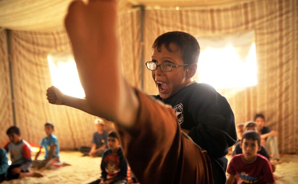 Photos: Syrian children learn Taekwondo in refugee camps