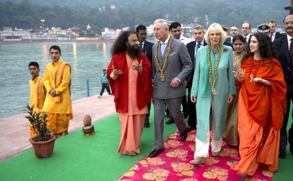 Britain's Prince Charles, Prince of Wales (2nd L) and Britain's Camilla, Duchess of Cornwall (2nd R), arrive to attend the Sunset aarti ceremony by the Ganga. AFP Britain's Prince Charles, Prince of Wales (2nd L) and Britain's Camilla, Duchess of Cornwall (2nd R), arrive to attend the Sunset aarti ceremony by the Ganga. AFP