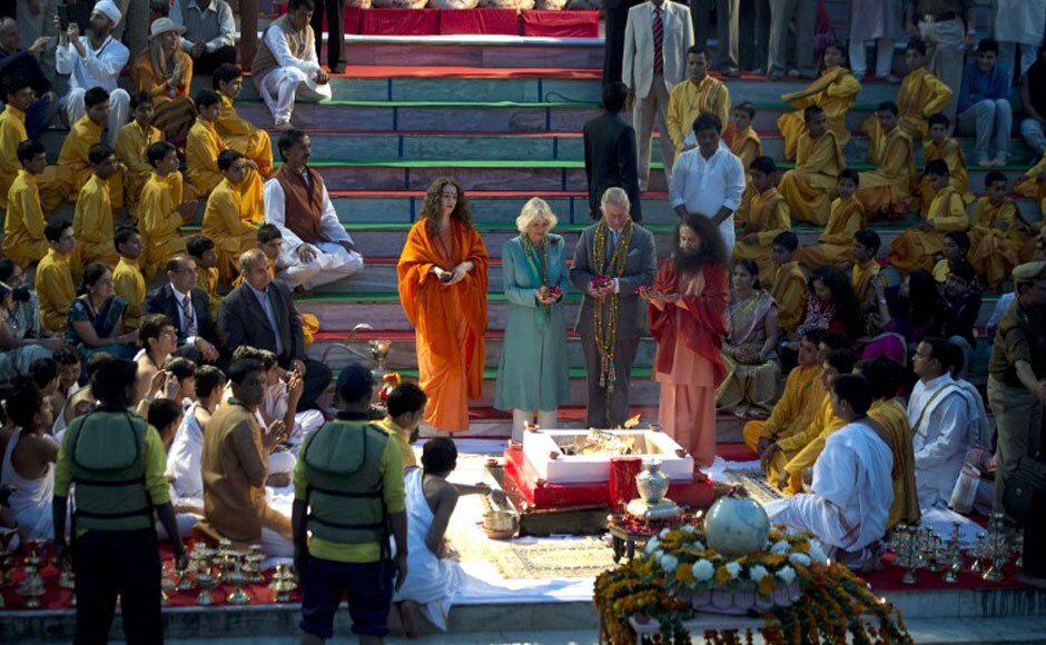 Britain's Prince Charles, Prince of Wales (C-R) and Britain's Camilla, Duchess of Cornwall (C-L), attend the sunset aarti"ceremony by the river Ganga. AFP Britain's Prince Charles, Prince of Wales (C-R) and Britain's Camilla, Duchess of Cornwall (C-L), attend the sunset aarti"ceremony by the river Ganga. AFP