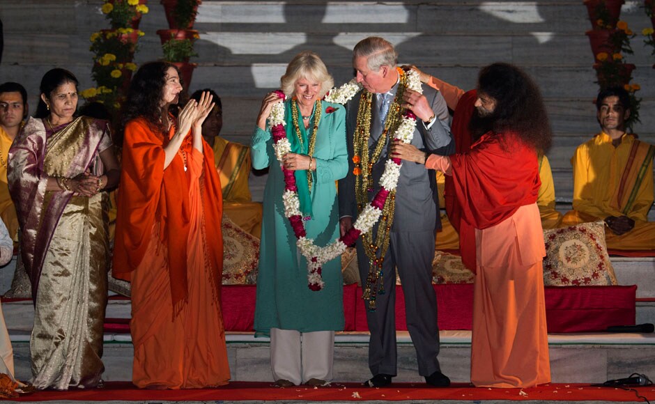 Britain's Prince Charles and Camilla, Duchess of Cornwall take part in a ritual that is part of the aarti ceremony at the Parmarth Miketan Temple on the banks of the Ganga. REUTERS Britain's Prince Charles and Camilla, Duchess of Cornwall take part in a ritual that is part of the aarti ceremony at the Parmarth Miketan Temple on the banks of the Ganga. REUTERS