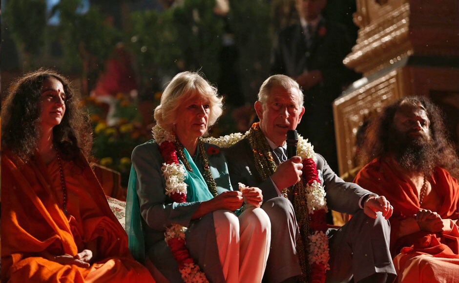Britain's Prince Charles (2nd R) addresses a gathering as his wife Camilla (2nd L), Duchess of Cornwall, watches after they performed a ritual during an aarti ceremony at the Parmarth Miketan Temple on the banks of the Ganga. REUTERS Britain's Prince Charles (2nd R) addresses a gathering as his wife Camilla (2nd L), Duchess of Cornwall, watches after they performed a ritual during an aarti ceremony at the Parmarth Miketan Temple on the banks of the Ganga. REUTERS