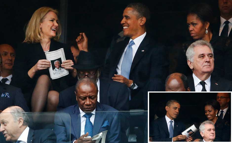 President Barack Obama jokes with Danish prime minister Helle Thorning-Schmidt, left, as first lady Michelle Obama looks on during the memorial service for former South African president Nelson Mandela at the FNB Stadium in Soweto, near Johannesburg, South Africa. AP/ Reuters President Barack Obama jokes with Danish prime minister Helle Thorning-Schmidt, left, as first lady Michelle Obama looks on during the memorial service for former South African president Nelson Mandela at the FNB Stadium in Soweto, near Johannesburg, South Africa. AP/ Reuters