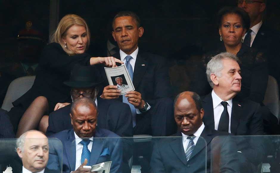 US President Barack Obama talks with Danish Prime Minister Helle Thorning-Schmidt, left, as US first lady Michelle Obama looks on at right during the memorial service for former South African president Nelson Mandela at the FNB Stadium in Soweto, near Johannesburg, South Africa. AP US President Barack Obama talks with Danish Prime Minister Helle Thorning-Schmidt, left, as US first lady Michelle Obama looks on at right during the memorial service for former South African president Nelson Mandela at the FNB Stadium in Soweto, near Johannesburg, South Africa. AP