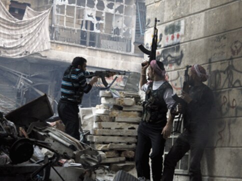 Suicide bomber with al-Qaeda links kills 13 soldiers in Syria