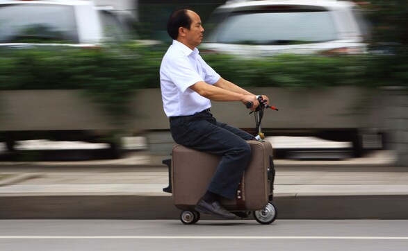 Photos: Man puts his baggage to good use, turns it into a scooter Photos: Man puts his baggage to good use, turns it into a scooter