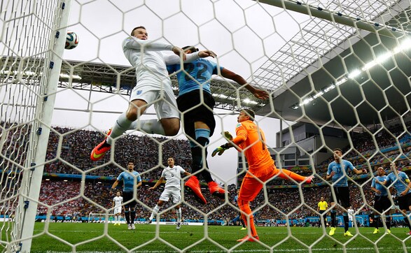 World Cup photos: Rooney finally scores but Suarez steals the show World Cup photos: Rooney finally scores but Suarez steals the show