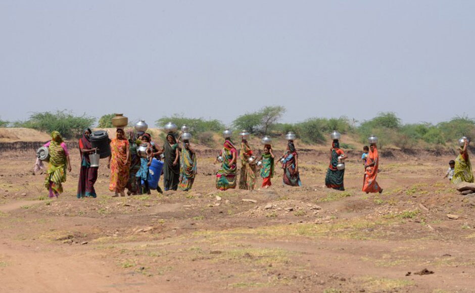 Village women carry pots as they walk to collect drinking water from a man-made well in the Sujangadh village of Surendranagar district. In most rural areas, the burden of collecting water for homes falls upon women, who are forced to walk daily in the torrid heat to fulfill this need. AFP Village women carry pots as they walk to collect drinking water from a man-made well in the Sujangadh village of Surendranagar district. In most rural areas, the burden of collecting water for homes falls upon women, who are forced to walk daily in the torrid heat to fulfill this need. AFP