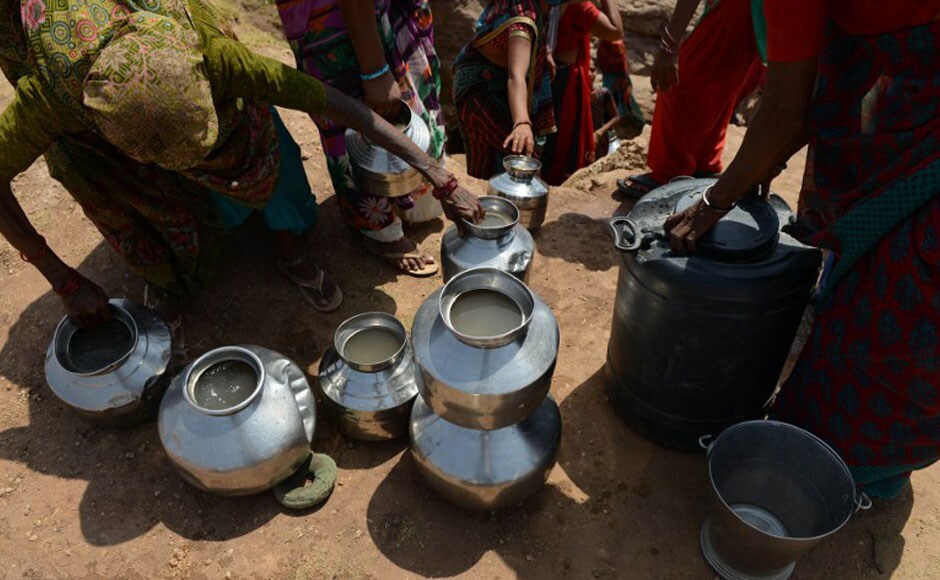 Pots filled with water are seen as women collect their daily supply in the village. AFP Pots filled with water are seen as women collect their daily supply in the village. AFP