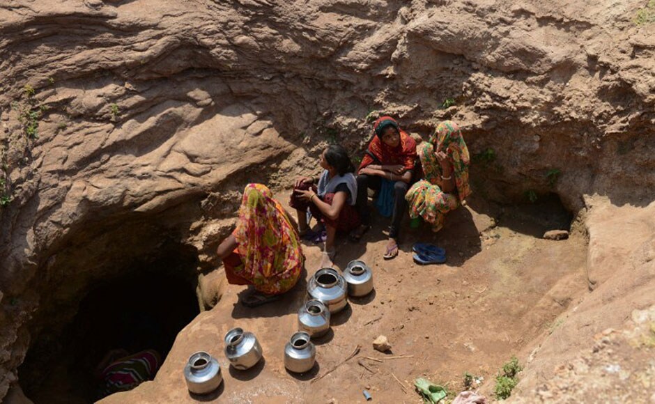 Women wait to collect water from the man-made well. Women usually end up carry two to three pots of water back home, which is often not enough for the daily needs of their family. AFP Women wait to collect water from the man-made well. Women usually end up carry two to three pots of water back home, which is often not enough for the daily needs of their family. AFP
