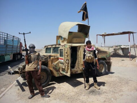 Iraq: Militants seize oilfields, surround US air base near Baghdad Iraq: Militants seize oilfields, surround US air base near Baghdad