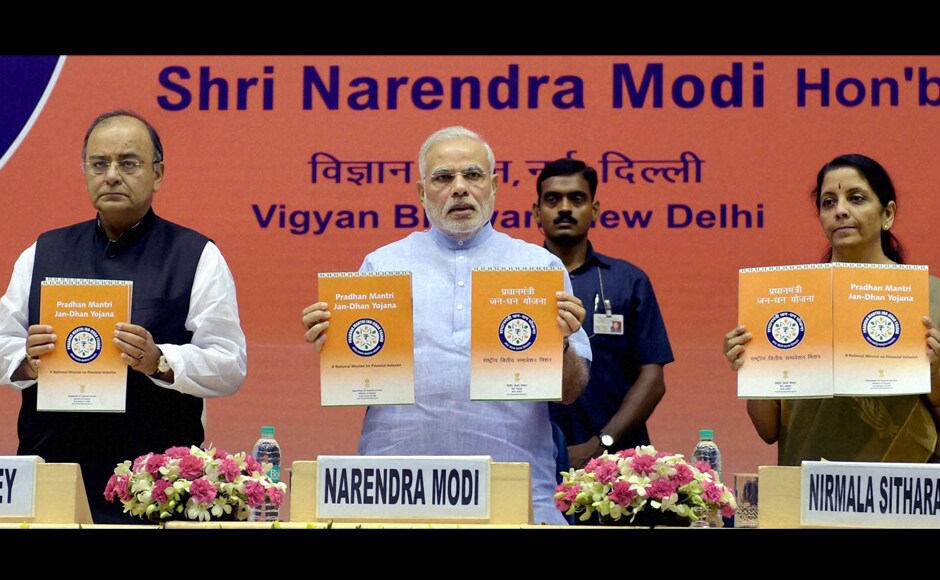 New Delhi: Prime Minister Narendra Modi with Finance Minister Arun Jaitley and MoS Nirmala Sitharaman releasing publications at the launch of the Pradhan Mantri Jan Dhan Yojana. Close to 1.5 crore accounts were opened with this scheme. PTI New Delhi: Prime Minister Narendra Modi with Finance Minister Arun Jaitley and MoS Nirmala Sitharaman releasing publications at the launch of the Pradhan Mantri Jan Dhan Yojana. Close to 1.5 crore accounts were opened with this scheme. PTI