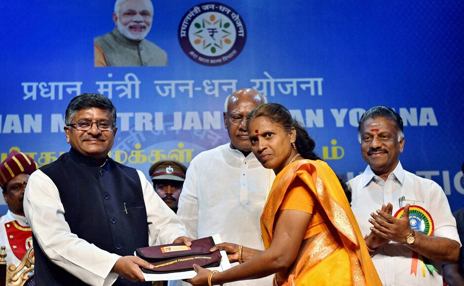 Chennai: Union Minister for Law and Justice, Communications and Information Technology, Ravi Shankar Prasad presents a kit to a beneficiary during the launch of 'Pradhan Mantri Jan Dhan Yojana' in Chennai on Thursday. PTI Photo by R Senthil Kumar Chennai: Union Minister for Law and Justice, Communications and Information Technology, Ravi Shankar Prasad presents a kit to a beneficiary during the launch of 'Pradhan Mantri Jan Dhan Yojana' in Chennai on Thursday. PTI Photo by R Senthil Kumar