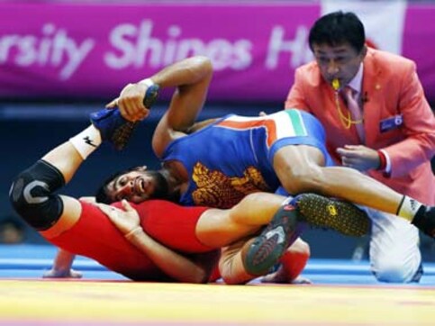 Asian Games wrestling: Bajrang adds silver, Narsingh bronze to Yogeshwar's gold Asian Games wrestling: Bajrang adds silver, Narsingh bronze to Yogeshwar's gold