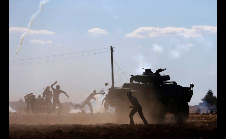 Turkish Kurdish protesters clash with Turkish security forces during a pro-Kurdish protest near the southeastern town of Suruc in Sanliurfa province on 22 September. Reuters Turkish Kurdish protesters clash with Turkish security forces during a pro-Kurdish protest near the southeastern town of Suruc in Sanliurfa province on 22 September. Reuters