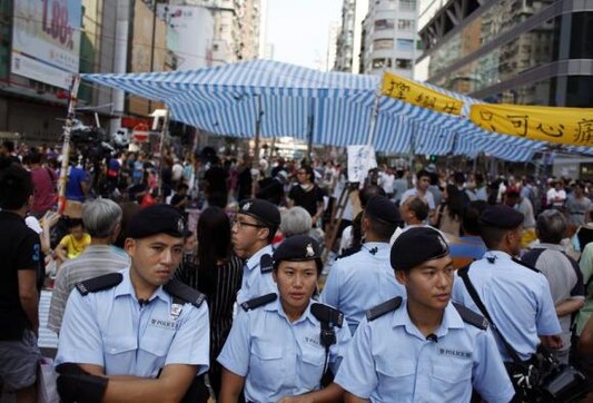 Insight - Chinese troops play symbolic role in Hong Kong drama over democracy Insight - Chinese troops play symbolic role in Hong Kong drama over democracy