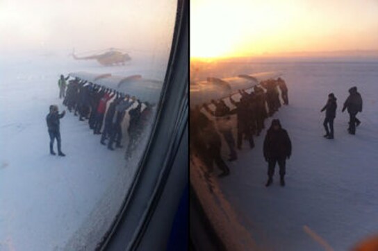 How to get a frozen plane rolling in Siberia? Get passengers to push it How to get a frozen plane rolling in Siberia? Get passengers to push it