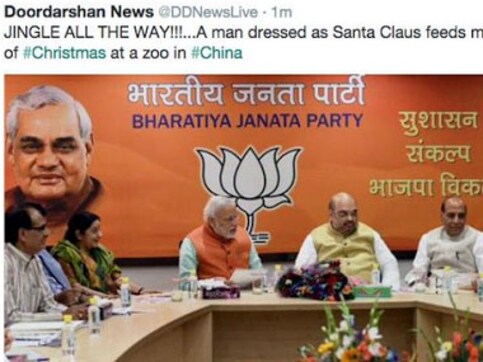 Another blooper: DD News tweets Modi's cabinet meet picture saying 'Santa feeds monkeys' Another blooper: DD News tweets Modi's cabinet meet picture saying 'Santa feeds monkeys'