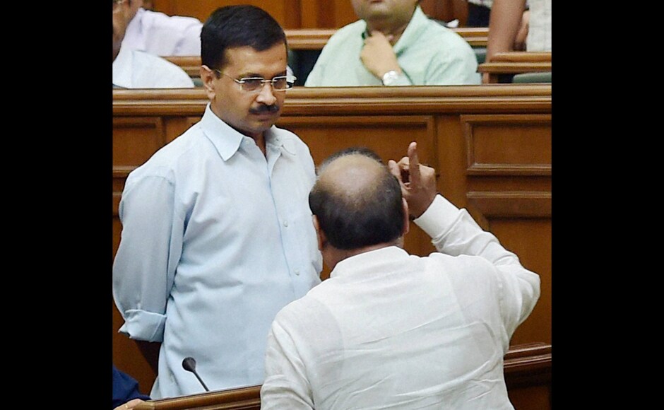 BJP MLA OP Sharma shout slogans in front of Delhi CM Arvind Kejriwal during a protest in the Assembly on the first day of the monsoon session in New Delhi on Tuesday. PTI BJP MLA OP Sharma shout slogans in front of Delhi CM Arvind Kejriwal during a protest in the Assembly on the first day of the monsoon session in New Delhi on Tuesday. PTI