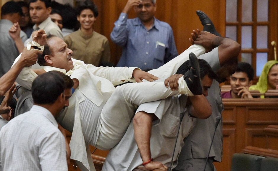 BJP leader in Delhi Assembly Vijender Gupta is taken out of the Assembly by marshals after a protest on the second day of the monsoon session in New Delhi on Wednesday. PTI BJP leader in Delhi Assembly Vijender Gupta is taken out of the Assembly by marshals after a protest on the second day of the monsoon session in New Delhi on Wednesday. PTI