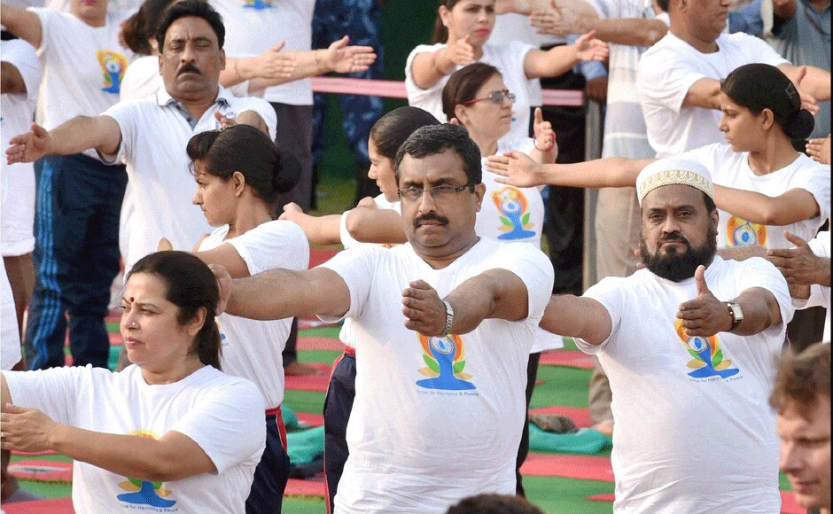 Meanwhile, at the Rajpath there were several other BJP leaders who joined PM Modi in performing yoga. Here we see Meenakshi Lekhi and Ram Madhav trying their hand at an asana. PTI Meanwhile, at the Rajpath there were several other BJP leaders who joined PM Modi in performing yoga. Here we see Meenakshi Lekhi and Ram Madhav trying their hand at an asana. PTI