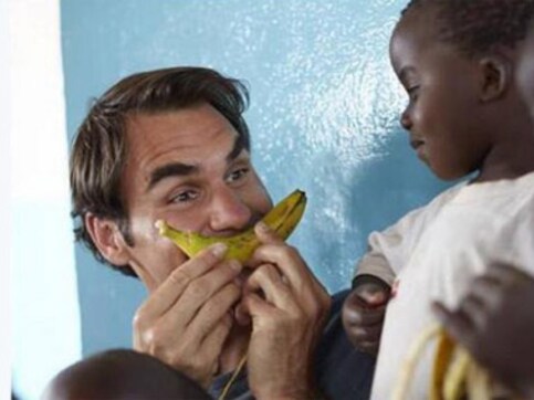 Making faces with a banana: Not just tennis, Federer's great with kids too Making faces with a banana: Not just tennis, Federer's great with kids too