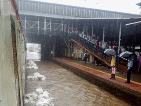 Heavy rains throws Mumbai out of gear with water logging, disruption of train services Heavy rains throws Mumbai out of gear with water logging, disruption of train services