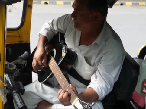 Watch: Nostalgic auto driver plays rider's guitar, reminisces about good old days Watch: Nostalgic auto driver plays rider's guitar, reminisces about good old days