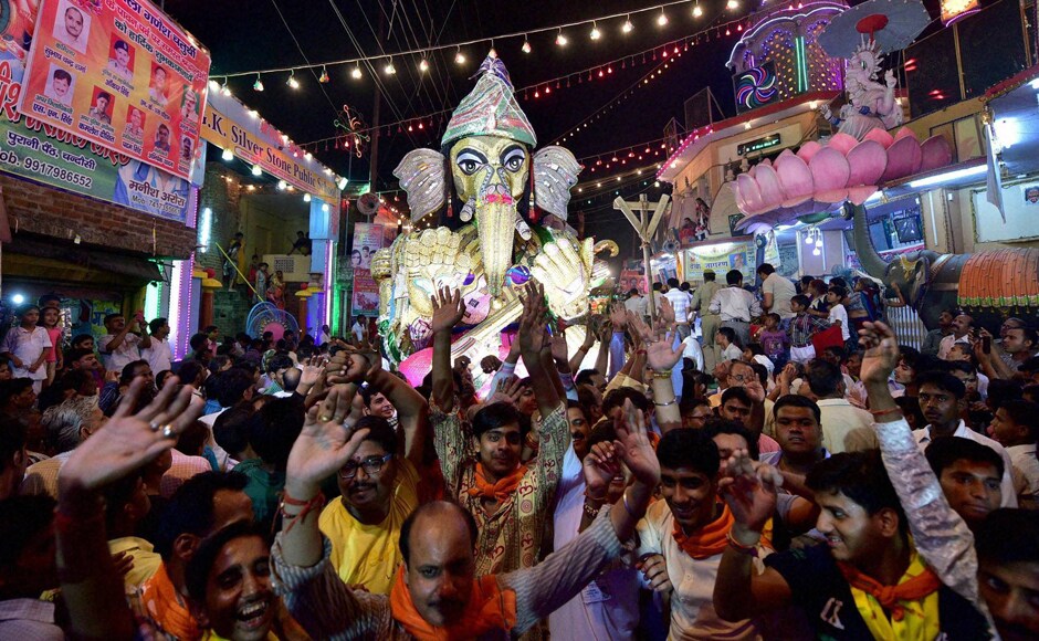 People celebrating the festival of the deity Ganpati during the Ganesh Chaturthi festival in Moradabad, Uttar Pradesh on Thursday. Image courtesy: PTI People celebrating the festival of the deity Ganpati during the Ganesh Chaturthi festival in Moradabad, Uttar Pradesh on Thursday. Image courtesy: PTI