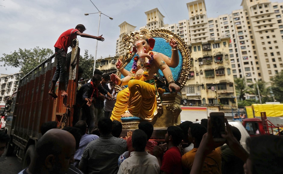 In Mumbai, devotees are seen carrying an idol of the elephant-headed god. There are said to be about 7,000 Ganpati mandals in the city, and several families celebrate the festival at their homes as well. Image courtesy: Reuters In Mumbai, devotees are seen carrying an idol of the elephant-headed god. There are said to be about 7,000 Ganpati mandals in the city, and several families celebrate the festival at their homes as well. Image courtesy: Reuters