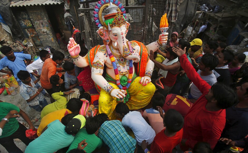 Devotees are seen preparing to load a Ganesh idol onto a truck to a place of worship in New Delhi. REUTERS/Anindito Mukherjee Devotees are seen preparing to load a Ganesh idol onto a truck to a place of worship in New Delhi. REUTERS/Anindito Mukherjee