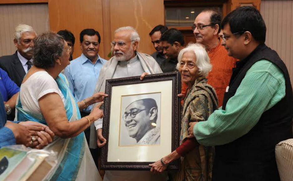 Prime Minister Narendra Modi accepts a portrait of Netaji Subhash Chandra Bose from the late leader's family members at 7 Race Course Road in New Delhi on Wednesday, 14 October. Image: PIB Prime Minister Narendra Modi accepts a portrait of Netaji Subhash Chandra Bose from the late leader's family members at 7 Race Course Road in New Delhi on Wednesday, 14 October. Image: PIB