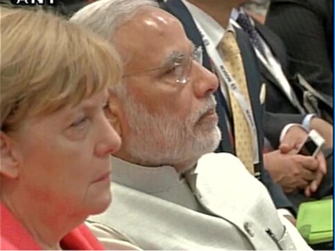 Merkel lands in Bengaluru: With PM Modi, German Chancellor visits automotive major Bosch's facility Merkel lands in Bengaluru: With PM Modi, German Chancellor visits automotive major Bosch's facility